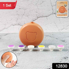 Close-up of the electric baby nail trimmer showing its six different grinding heads.