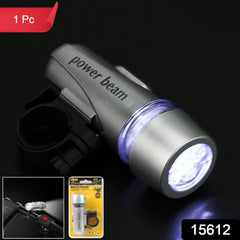 Powerful white LED bicycle headlight illuminating a dark road ahead.