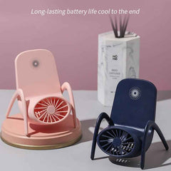 Multi-function fan used as a desk fan, cooling a person working on a laptop.