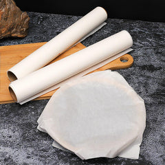 Non-stick baking paper roll displayed in a modern kitchen setting.