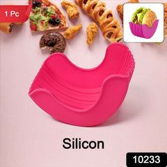 Hand holding a hamburger securely in the reusable burger holder.