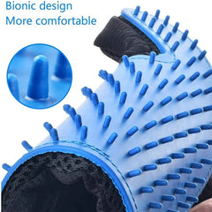 A hand wearing the pet deshedding glove gently grooming a dog's fur.