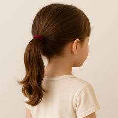 A neatly arranged stack of various coloured small hairbands, highlighting the wide selection in the pack.