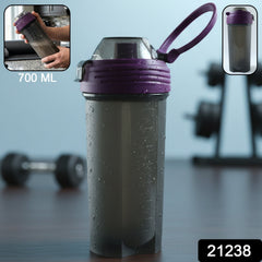 Clear plastic protein shaker bottle with secure flip lid