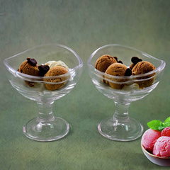 Elegant glass dessert bowl on a footed base, perfect for serving.