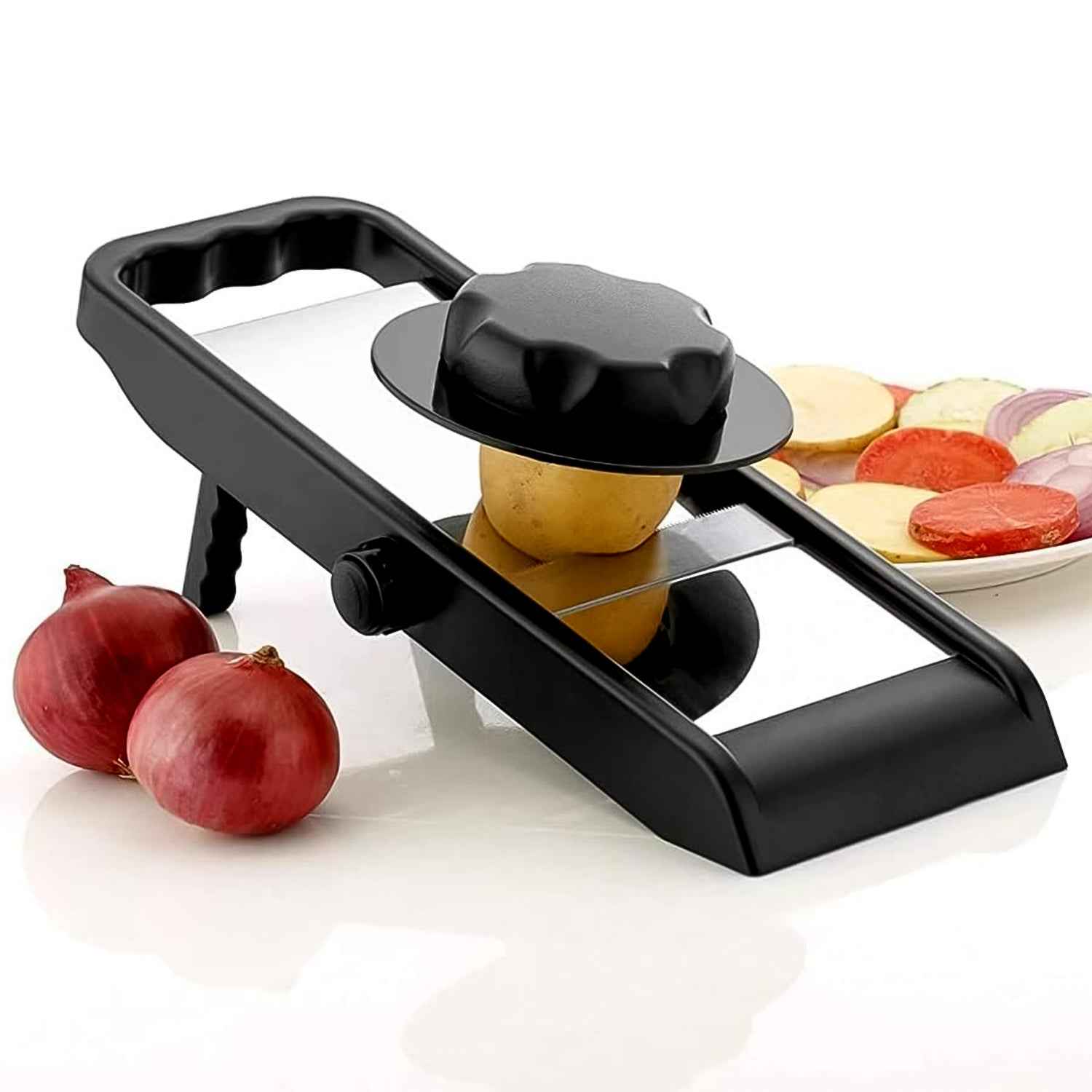 Hand slicing a potato into perfect, even chips using the adjustable slicer.