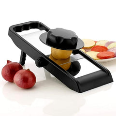 Hand slicing a potato into perfect, even chips using the adjustable slicer.