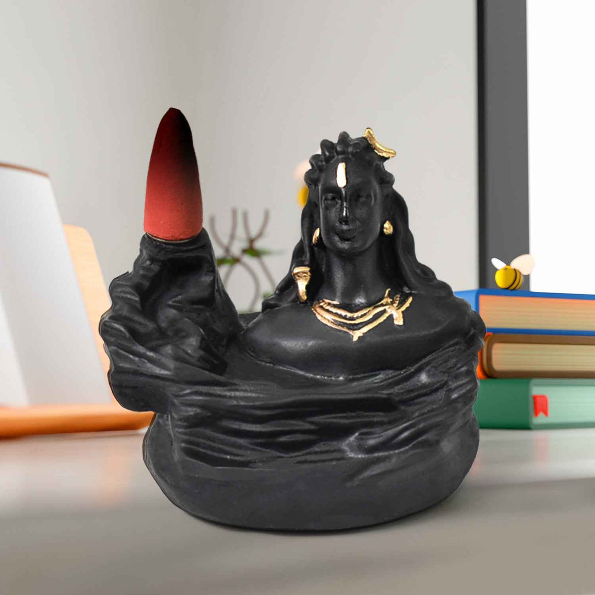 Adiyogi Shiva Backflow Incense Holder with smoke cascading downwards, creating a serene waterfall effect.