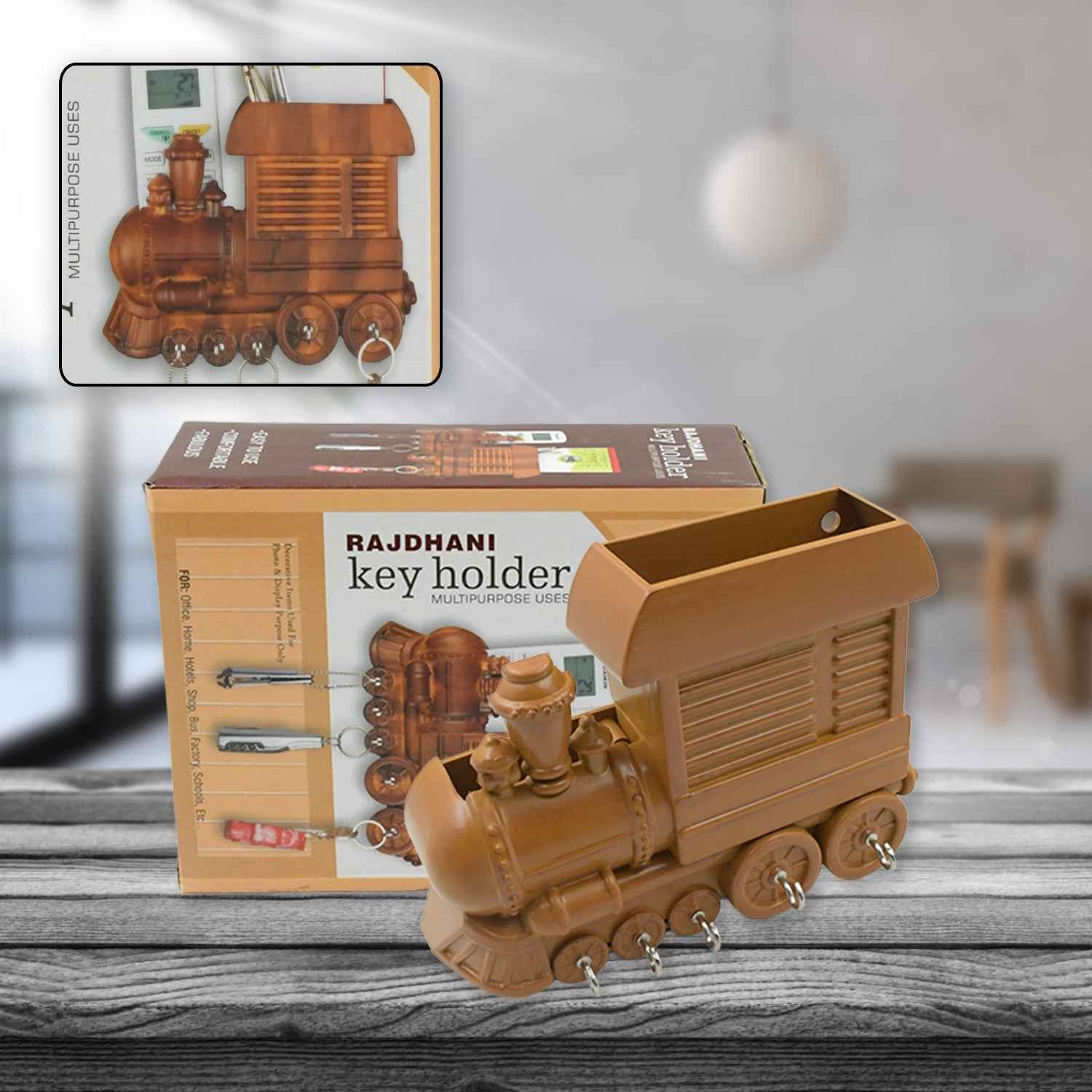 Brown plastic train key holder mounted on a white wall.