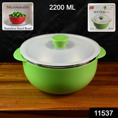 Microwave-safe plastic serving bowl filled with hot food and covered lid