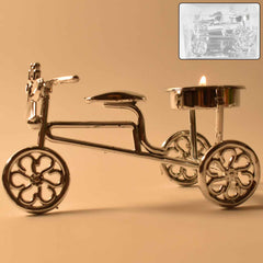 Cycle shaped tealight holder displaying warm candlelight indoors