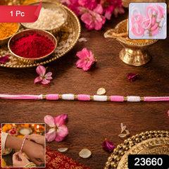 Pink & White Thread Rakhi Ð Elegant Traditional Beaded Design