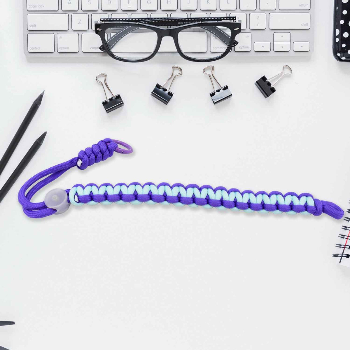 Multicolor adjustable phone wrist strap lanyard displayed on a clean surface.