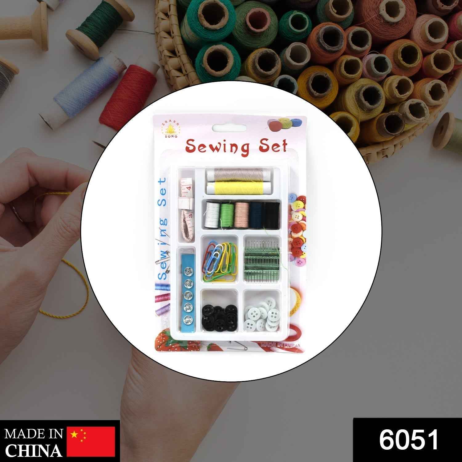 Open 62-piece sewing kit showcasing various needles, buttons, and measuring tape.
