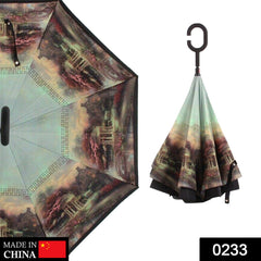 Close-up of the automatic button on the stylish metal handle of the reverse umbrella.