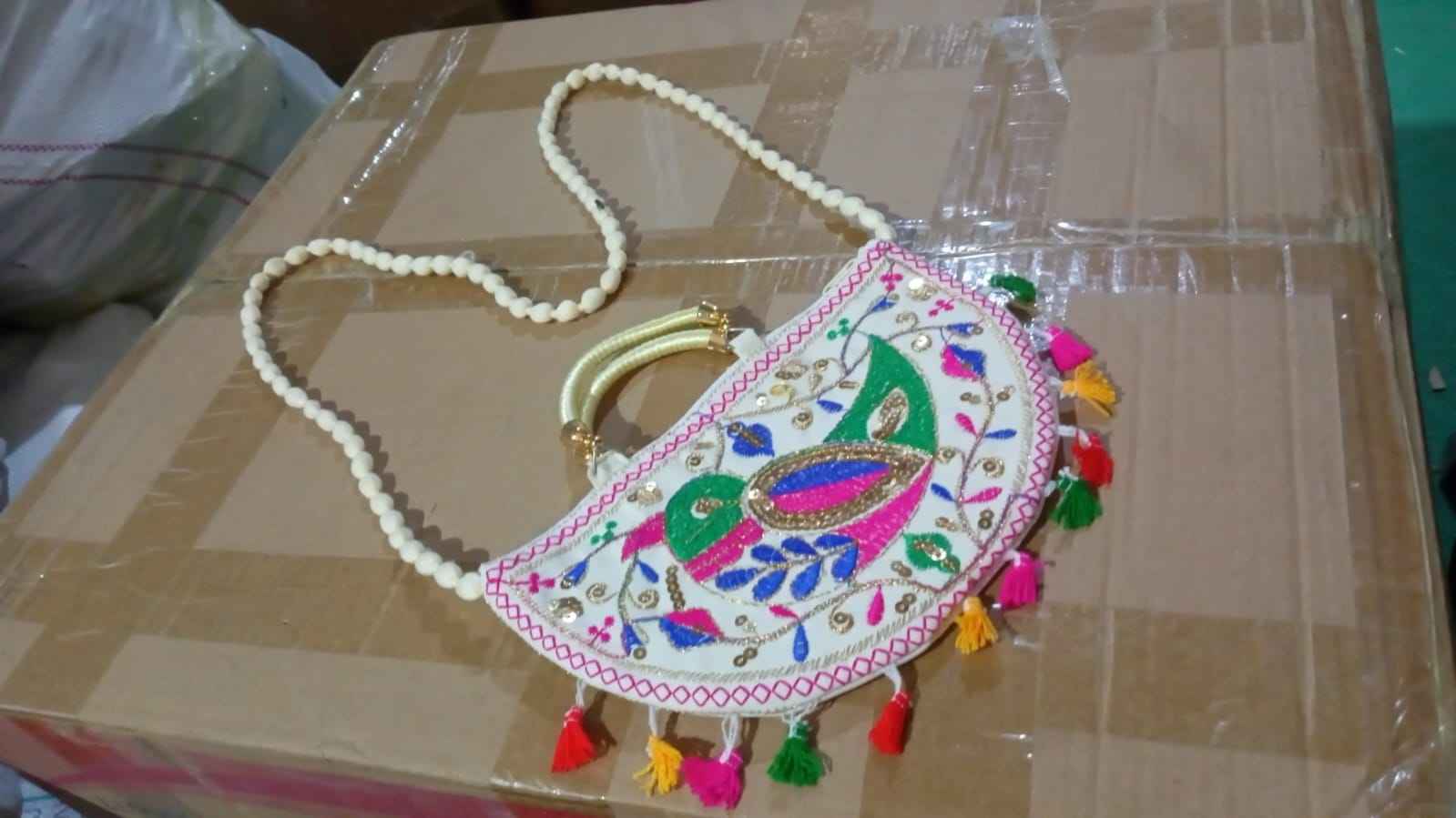 Lifestyle shot of the colorful Rajasthani handbag, perfect for everyday ethnic wear.