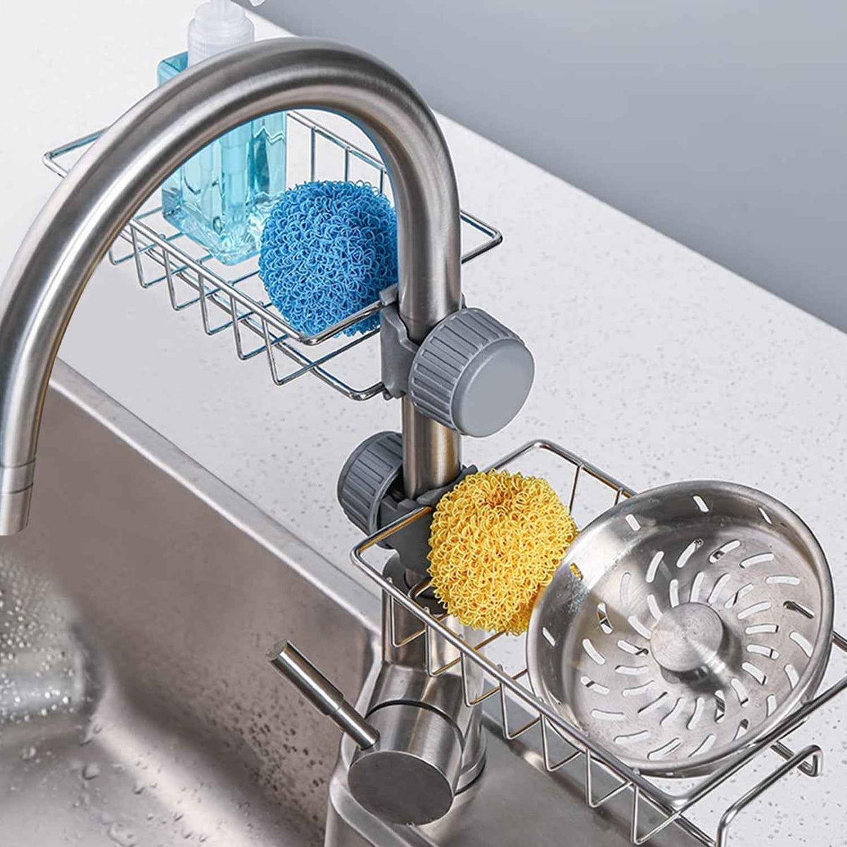 Stainless steel sink caddy organizer holding soap and sponge on kitchen sink