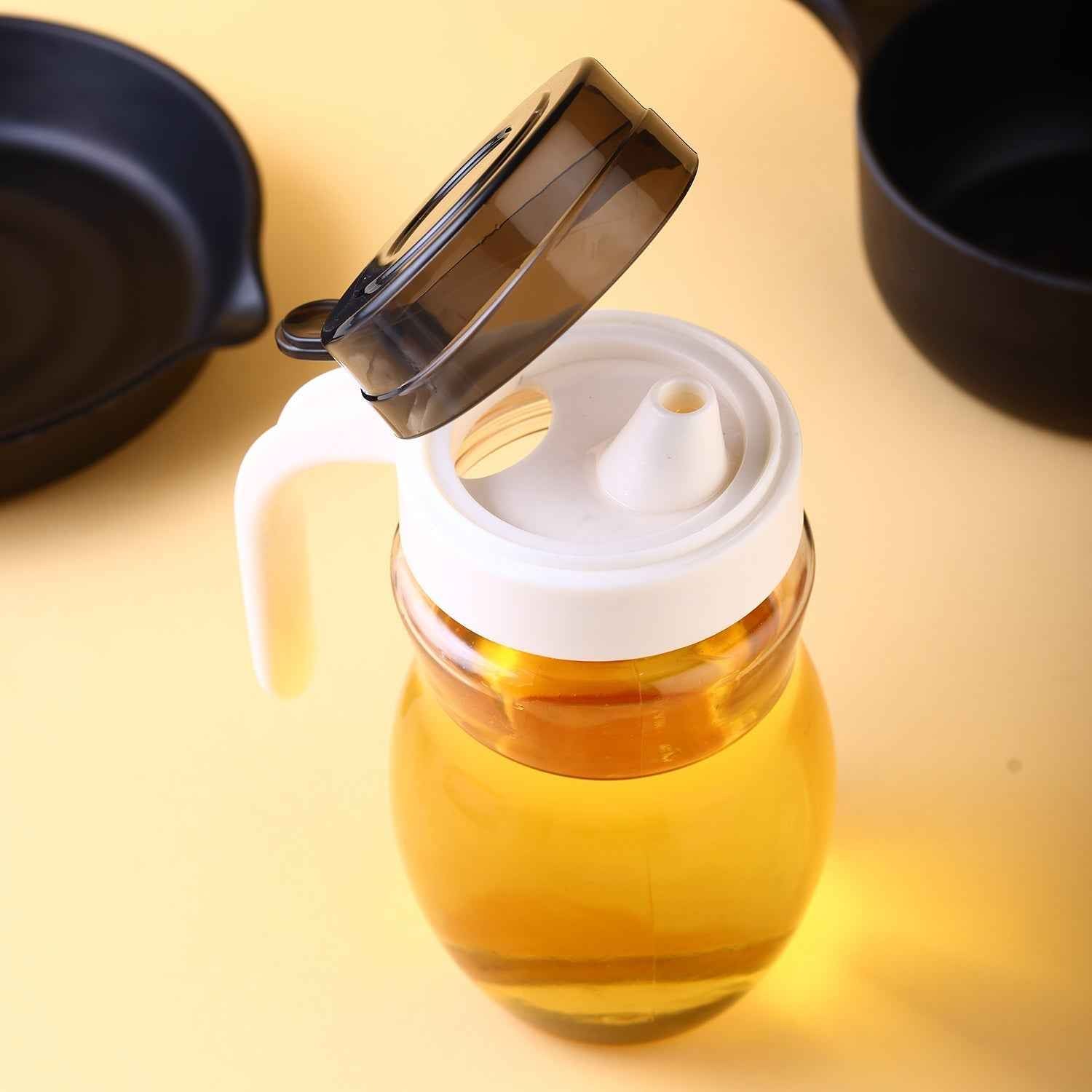 Durable plastic oil bottle with an easy-pour spout.