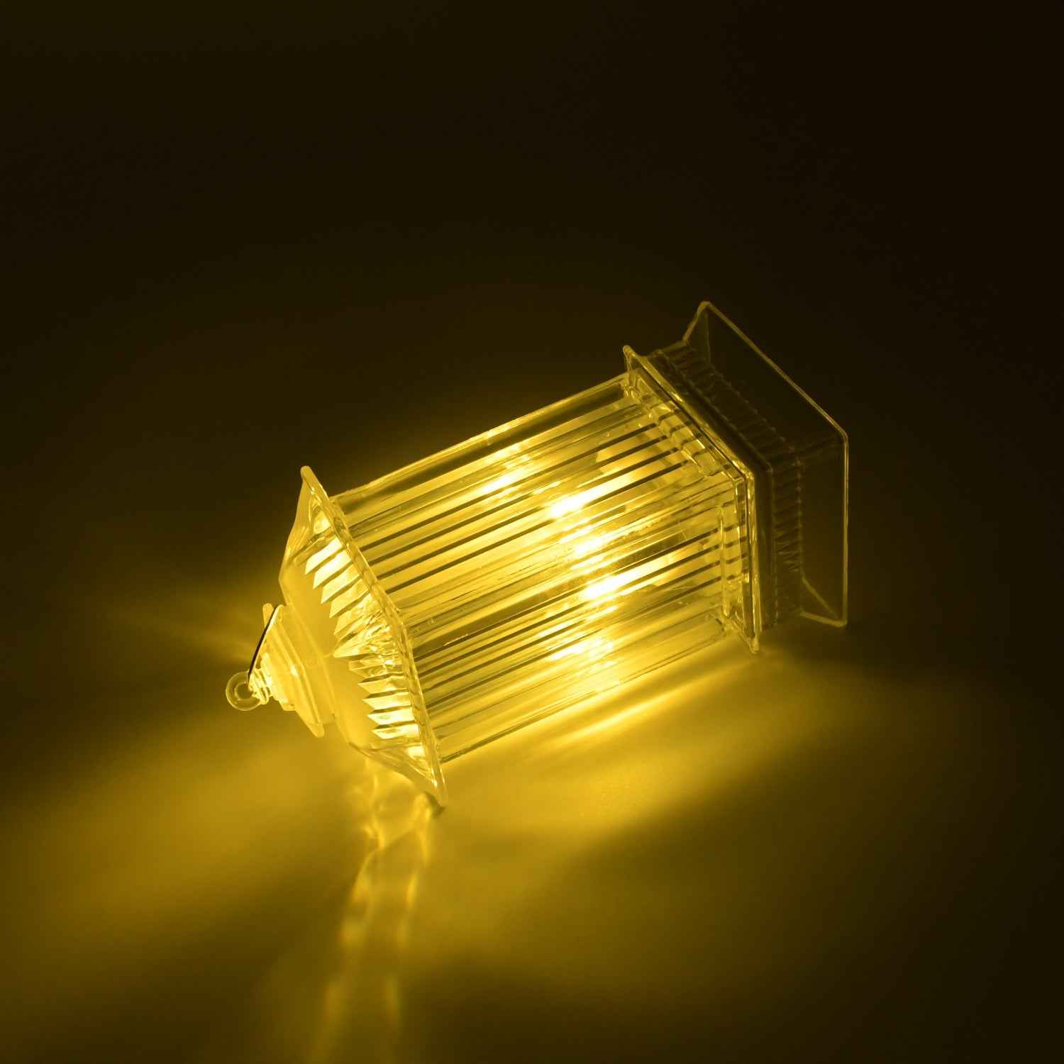 Close-up of the acrylic crystal table lamp with a warm flickering LED candle light.