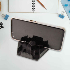 Multi-angle hexagonal plastic mobile phone stand positioned on desk