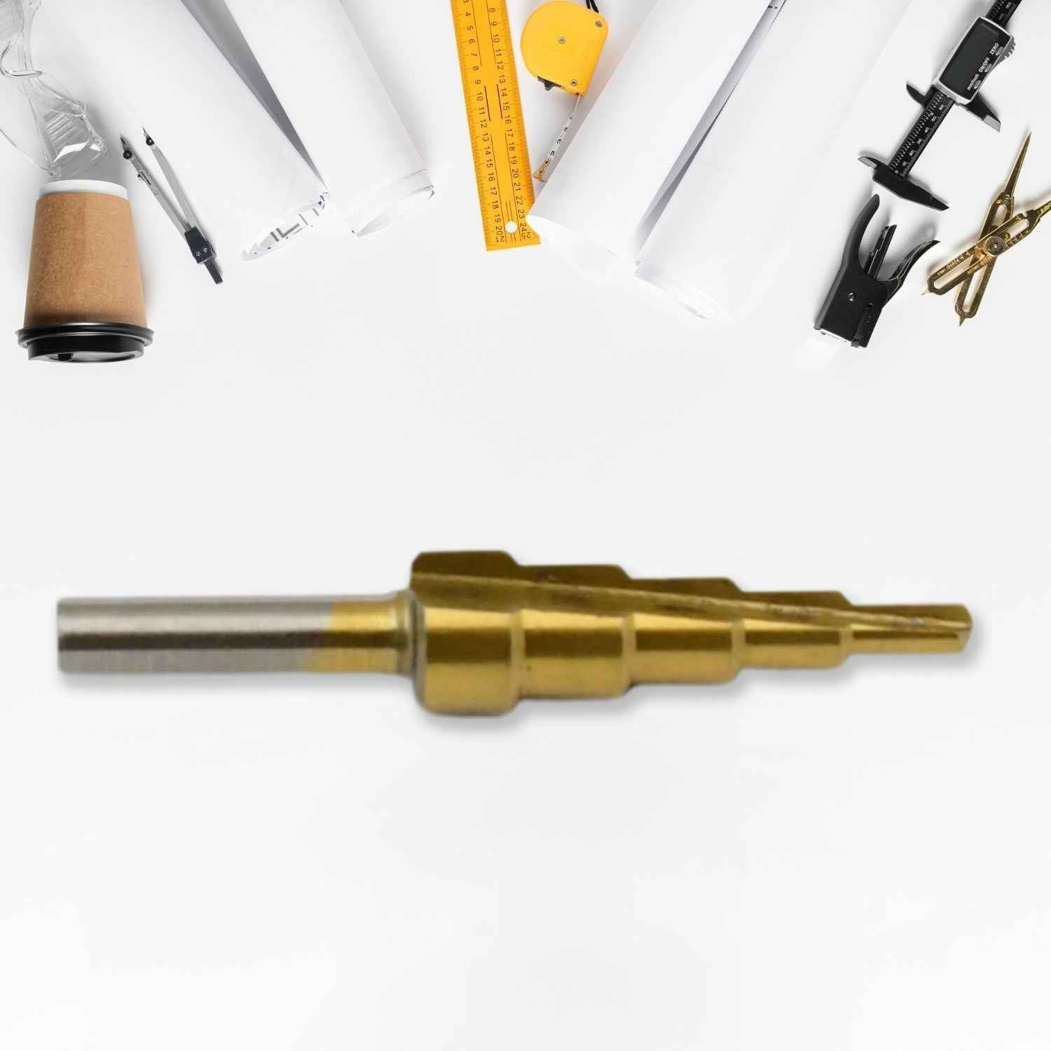 The versatile Step Drill Bit by Wagtail shown against a blurred workshop background.