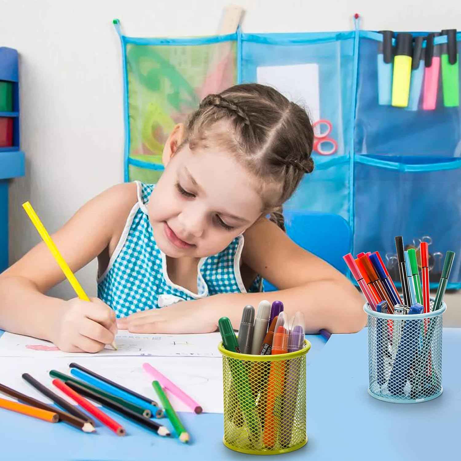 Empty black metal mesh pen holder, showcasing its minimalist design.