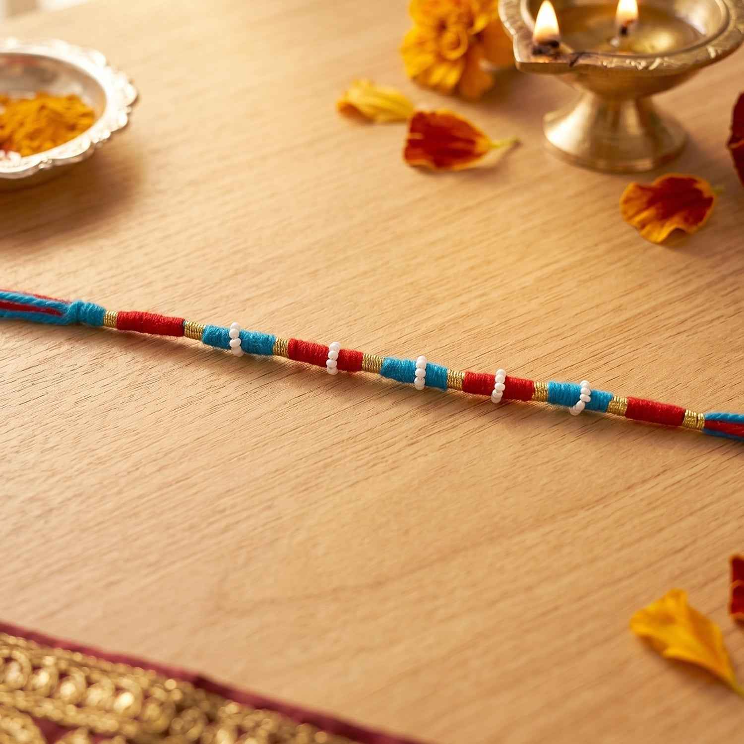 Handmade Pearl Beaded Rakhi Ð Elegant Traditional Gifting
