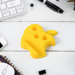 Side view of apple-shaped mobile stand with pen holder holding a smartphone