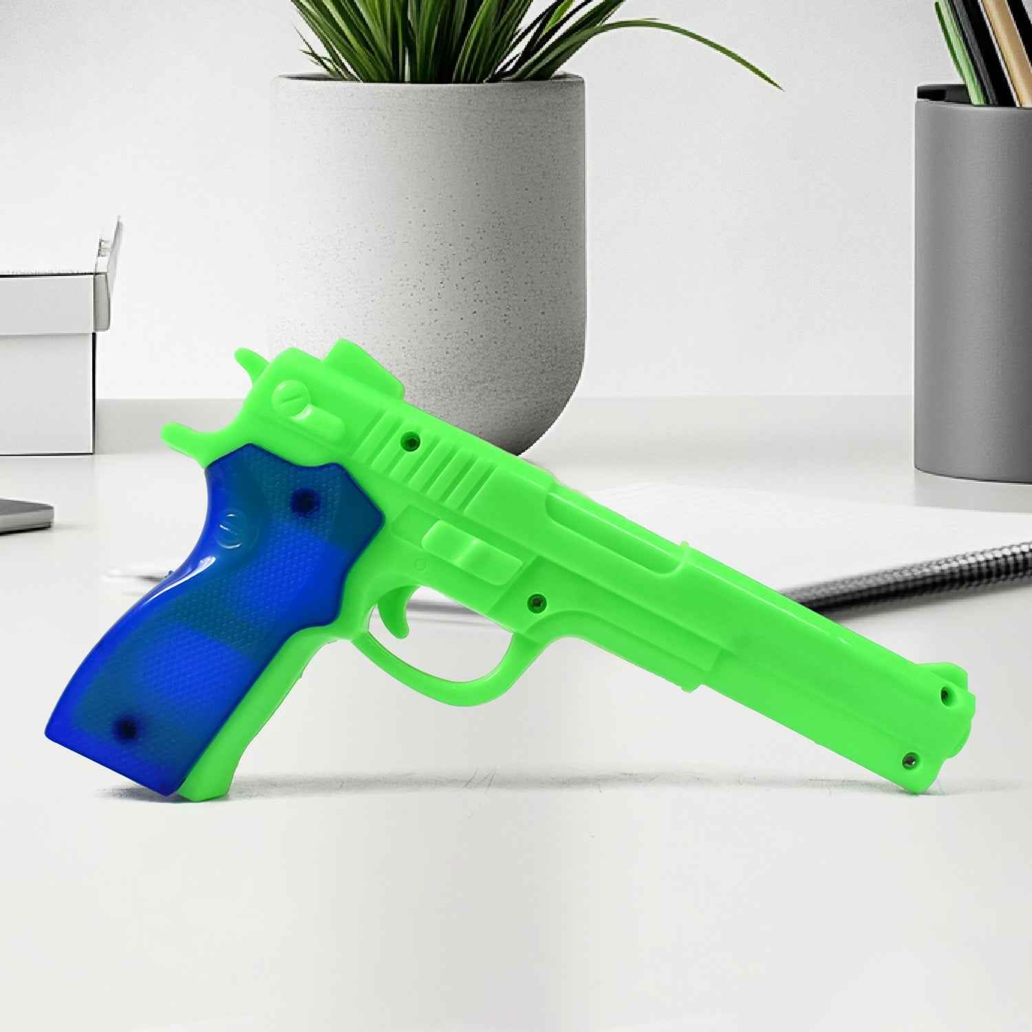 Side view of the Aditi toy gun, ready for play.