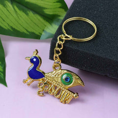 Krishna Peacock Keychain – Spiritual Golden Metal Charm