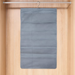 Foldable under garment organizer bag with multiple pockets hanging in closet