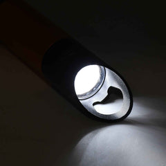 Mini LED torch illuminating a dark space, demonstrating its high lumen output.