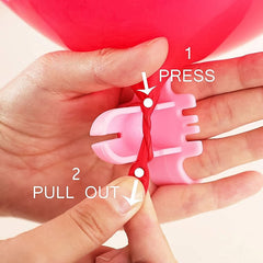 Balloon tying tool set in use for quick balloon assembly