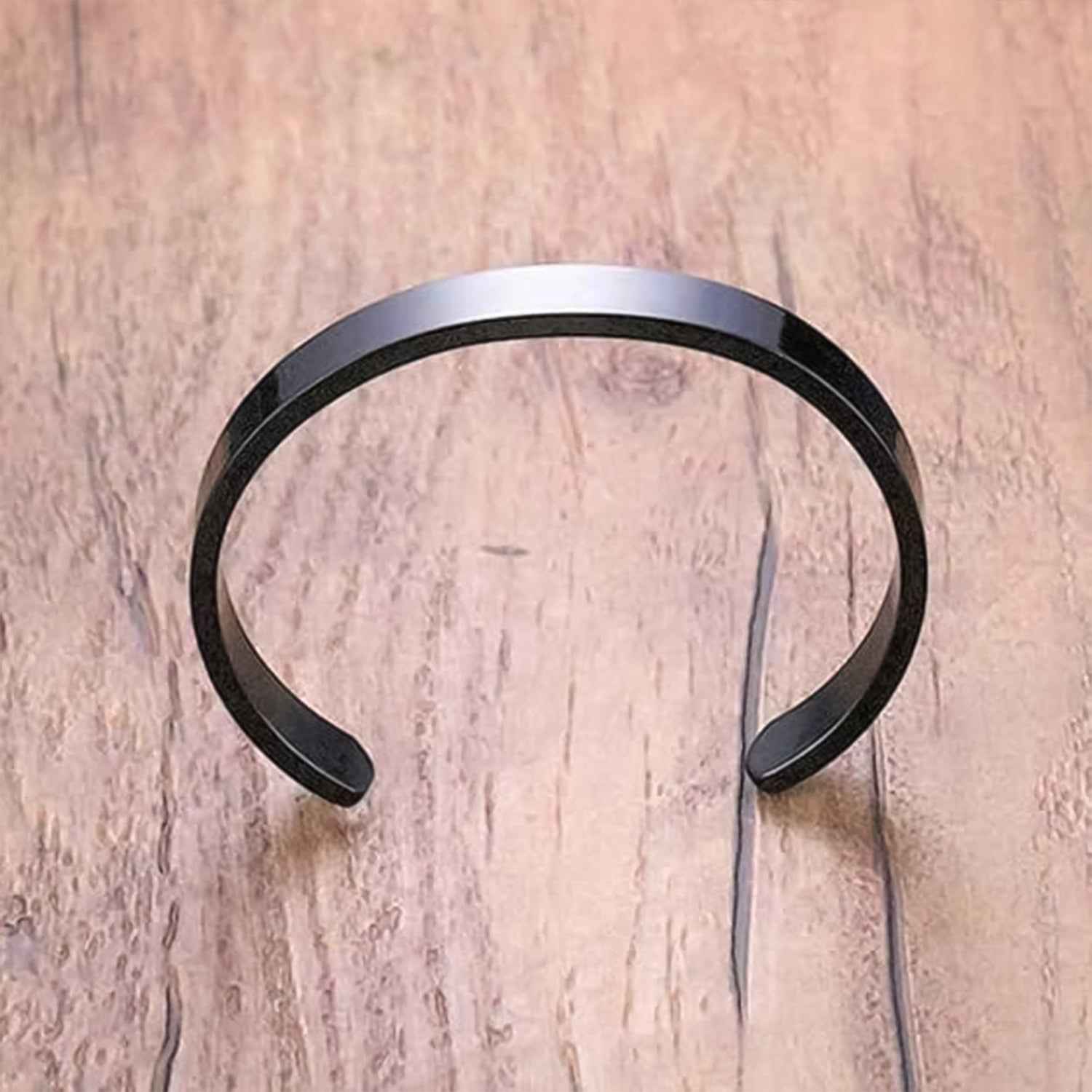 Side view of stylish black-plated stainless steel men's kada bracelet