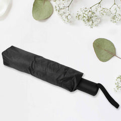 Compact umbrella easily sliding into a backpack pocket, highlighting its portability.