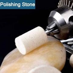 A wool felt buffing wheel in action, polishing a stone surface to a smooth finish.
