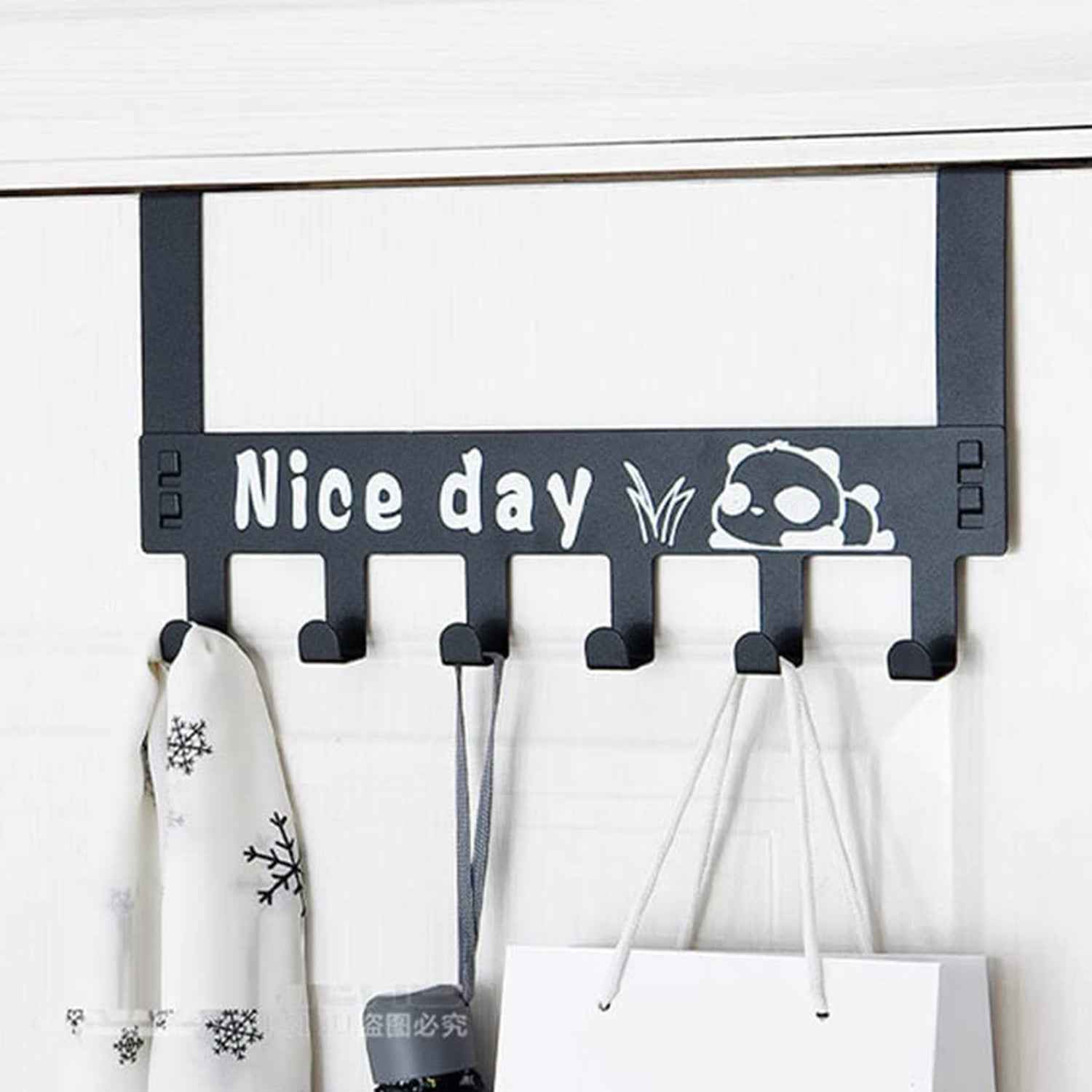 Detail of the 'Nice Day' panda cartoon design on the door hanger for a playful touch.