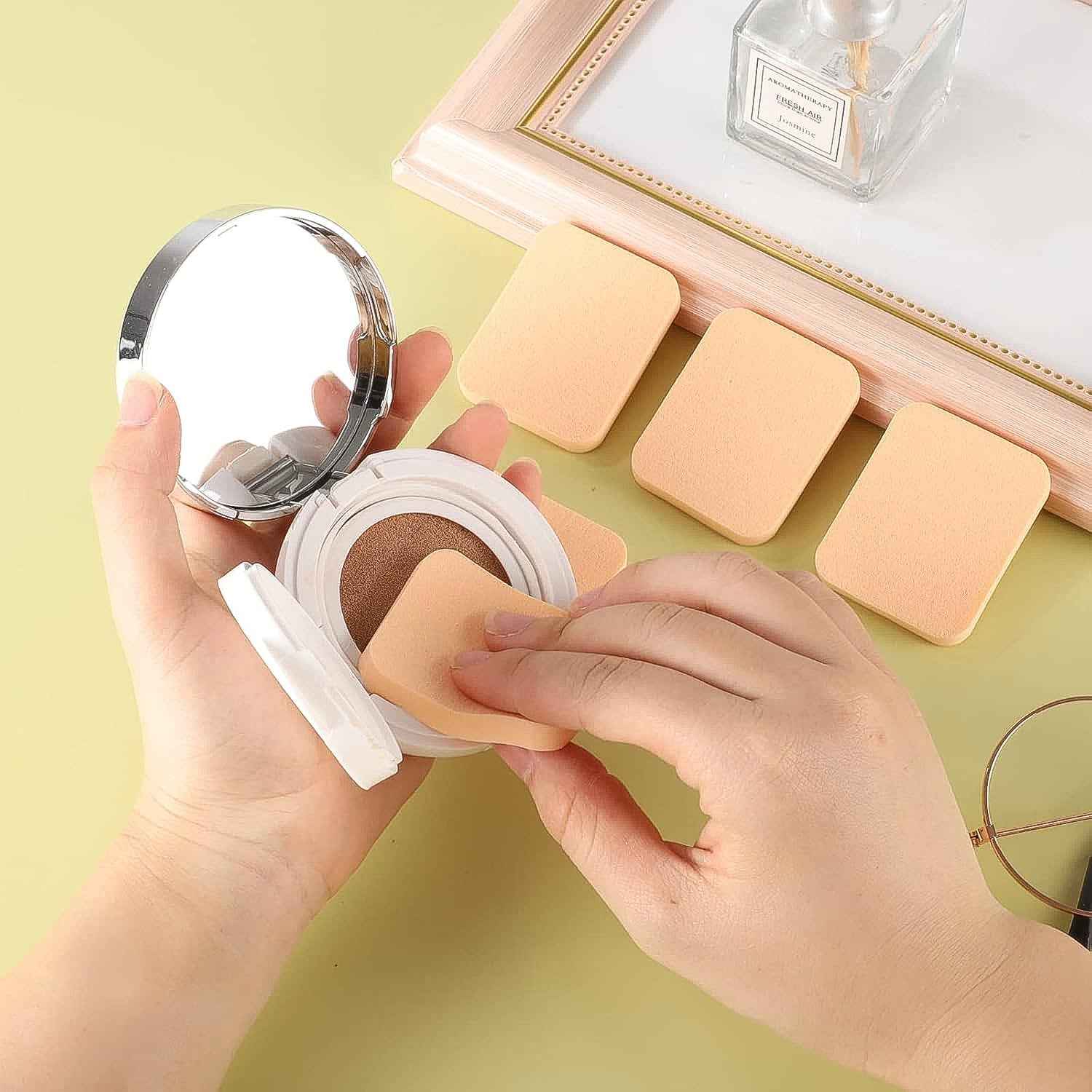 Ergonomically designed makeup sponges in different colors for blending and contouring.