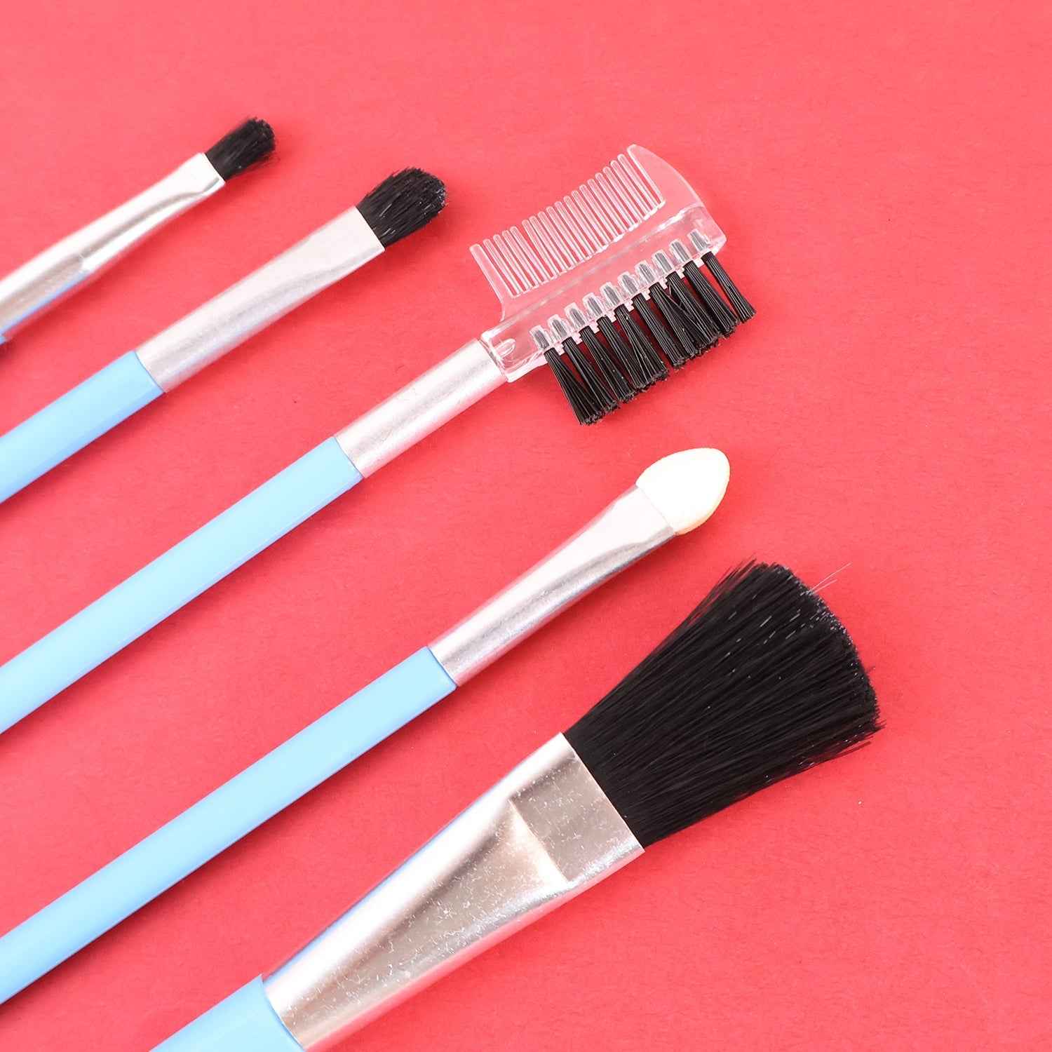 Detailed view of the angled liner and blush brushes from the makeup set for precise application.
