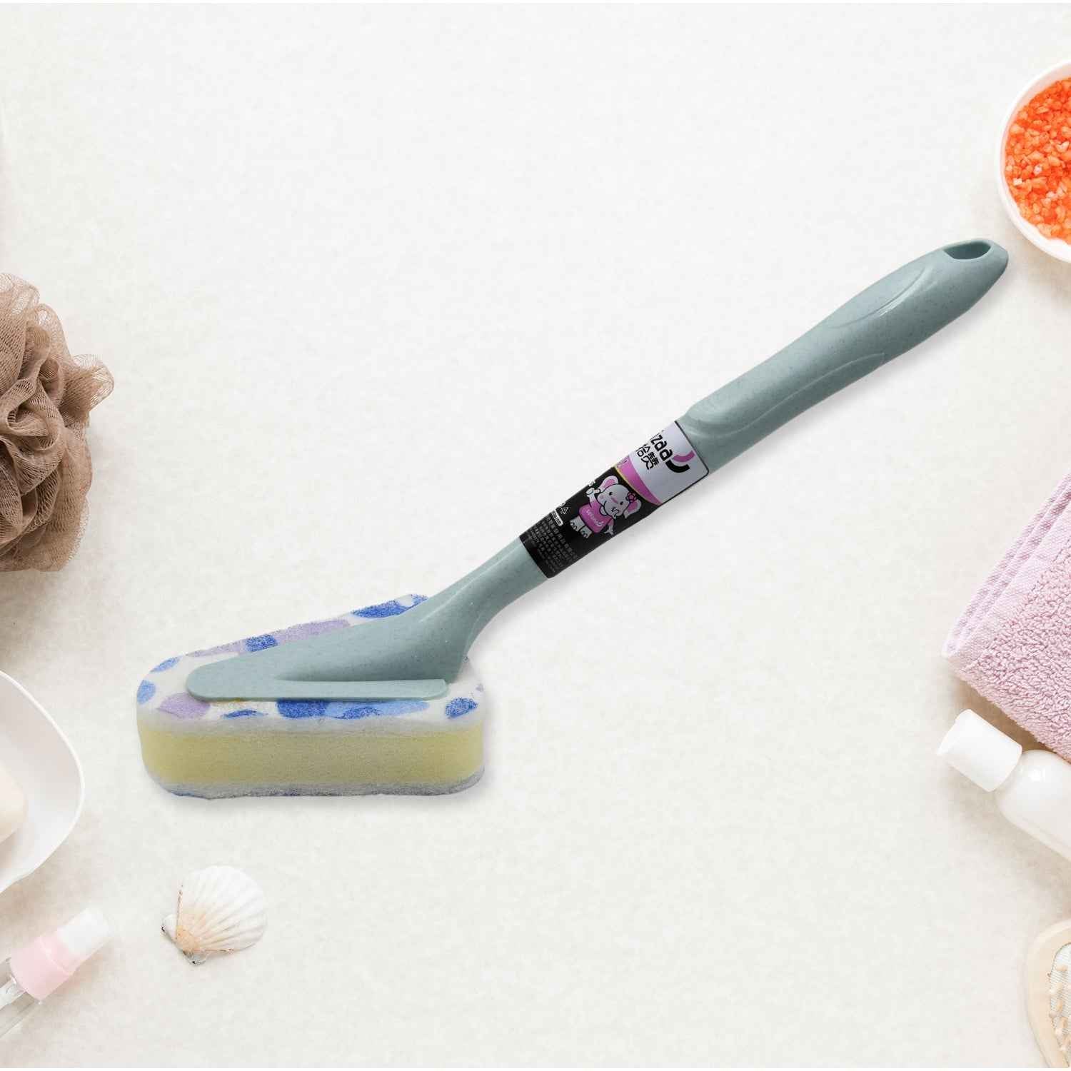 The versatile triangular cleaning brush resting on a bathroom counter.