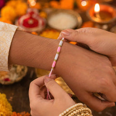 Pink & White Thread Rakhi Ð Elegant Traditional Beaded Design