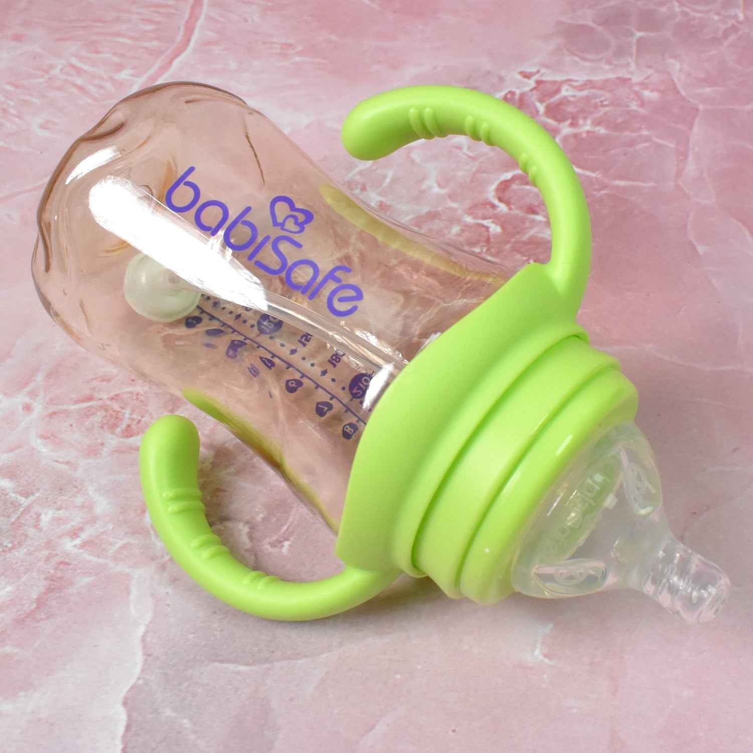 Close-up of the silicone nipple and weighted straw inside the Plastic Baby Feeding Bottle.