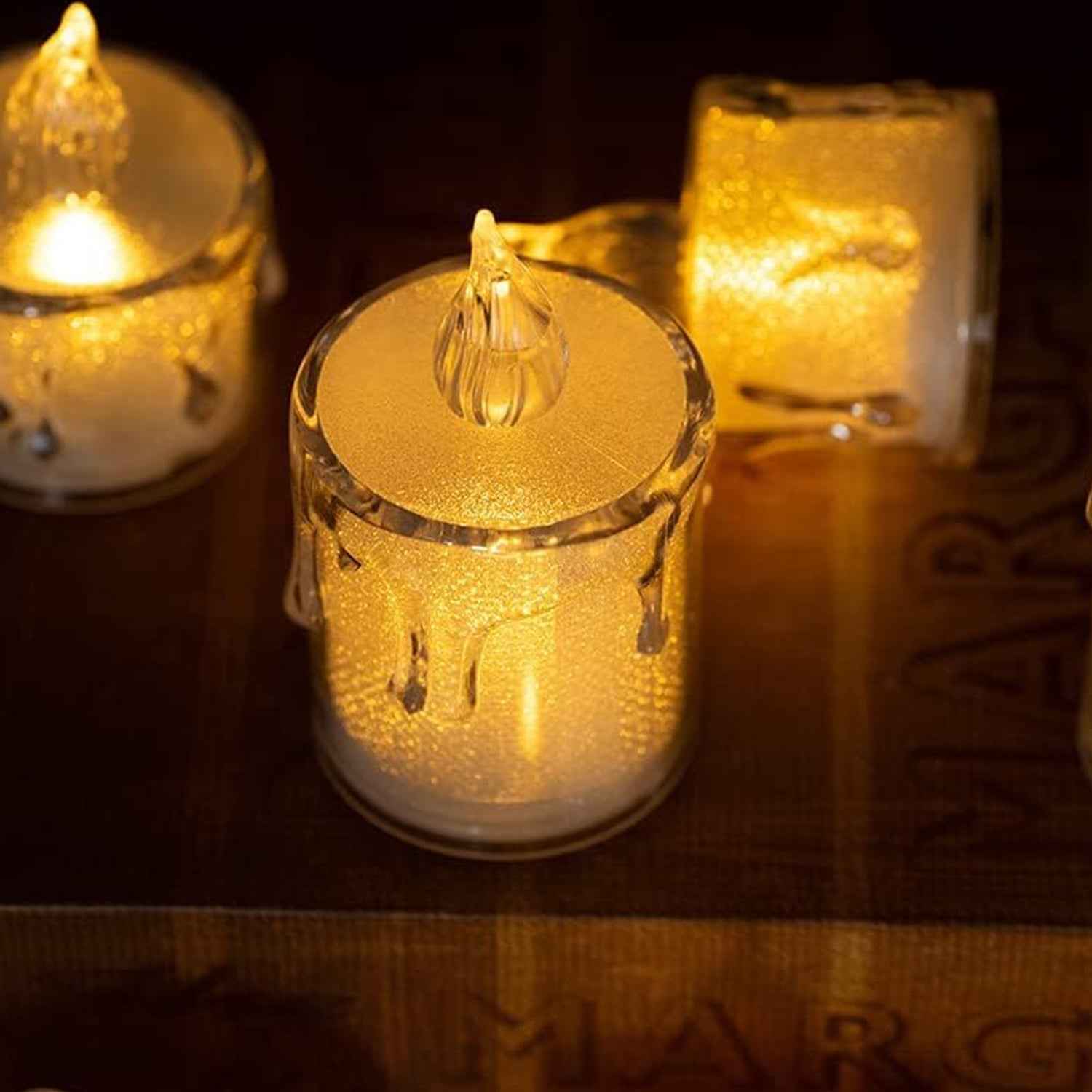 Group of sparkling crystal LED candles arranged for festive home decoration.