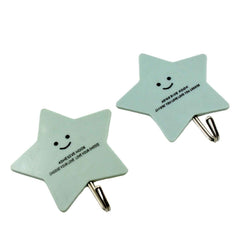 Close-up view of the robust adhesive backing on a GlimmerHome plastic sticky hook.