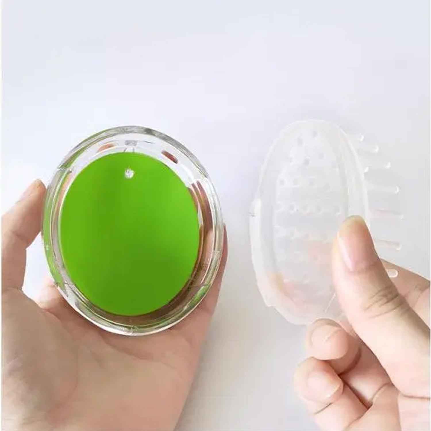 Close-up of the soft silicone bristles on the head massager.