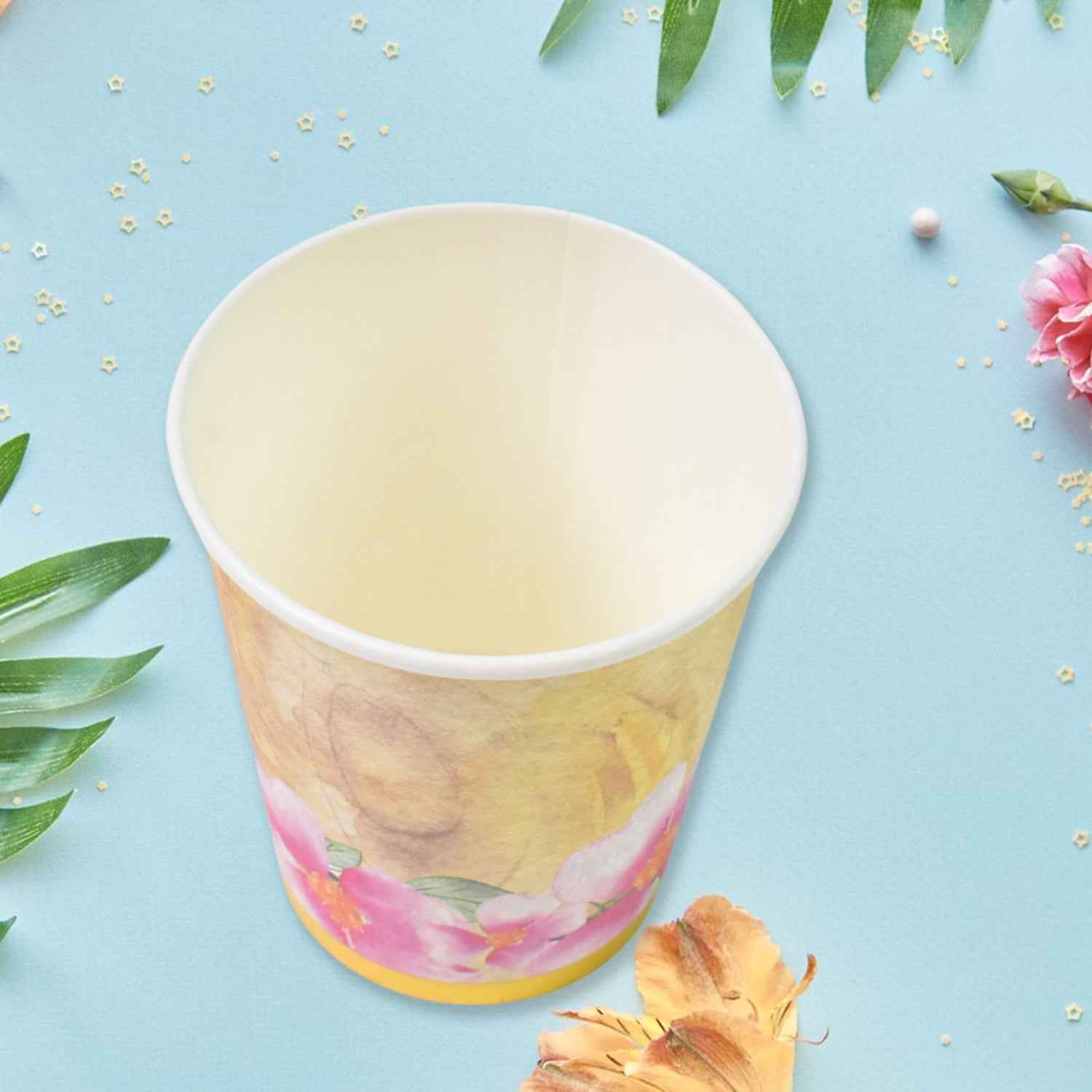 A hand holding one of the sturdy disposable tea coffee cups, showcasing its design.
