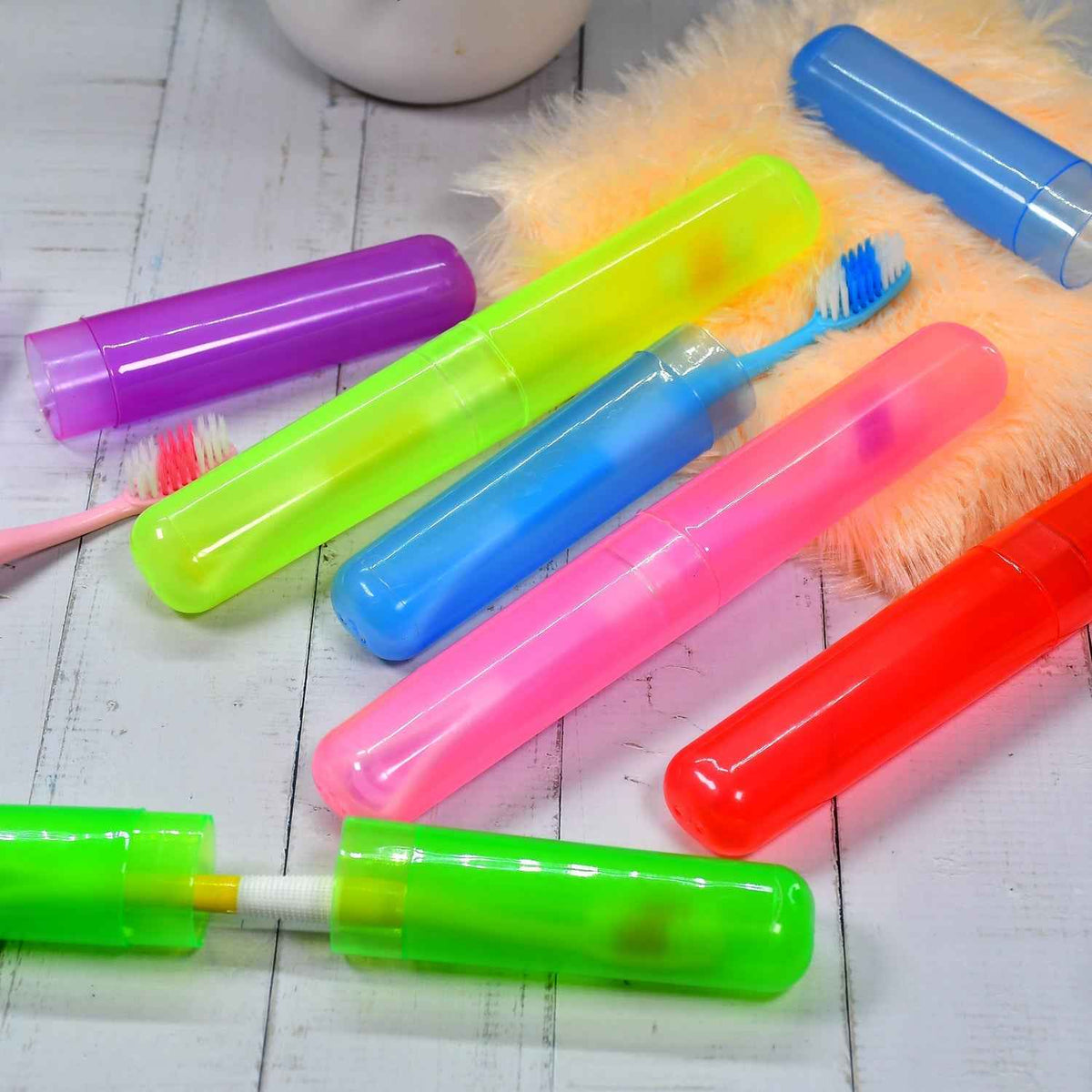 Six clear plastic travel toothbrush covers neatly stacked for hygienic storage.