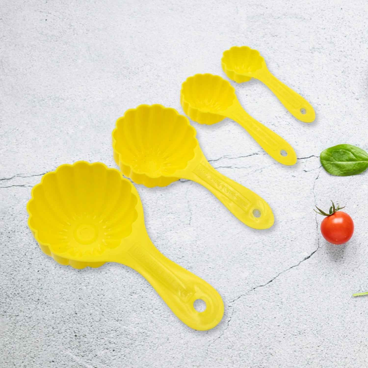 The complete set of four plastic ladoo making spoons, ideal for crafting various traditional sweets.