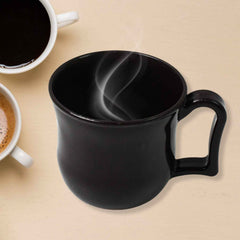 Close-up of the smooth, matte finish of a durable black plastic coffee mug.