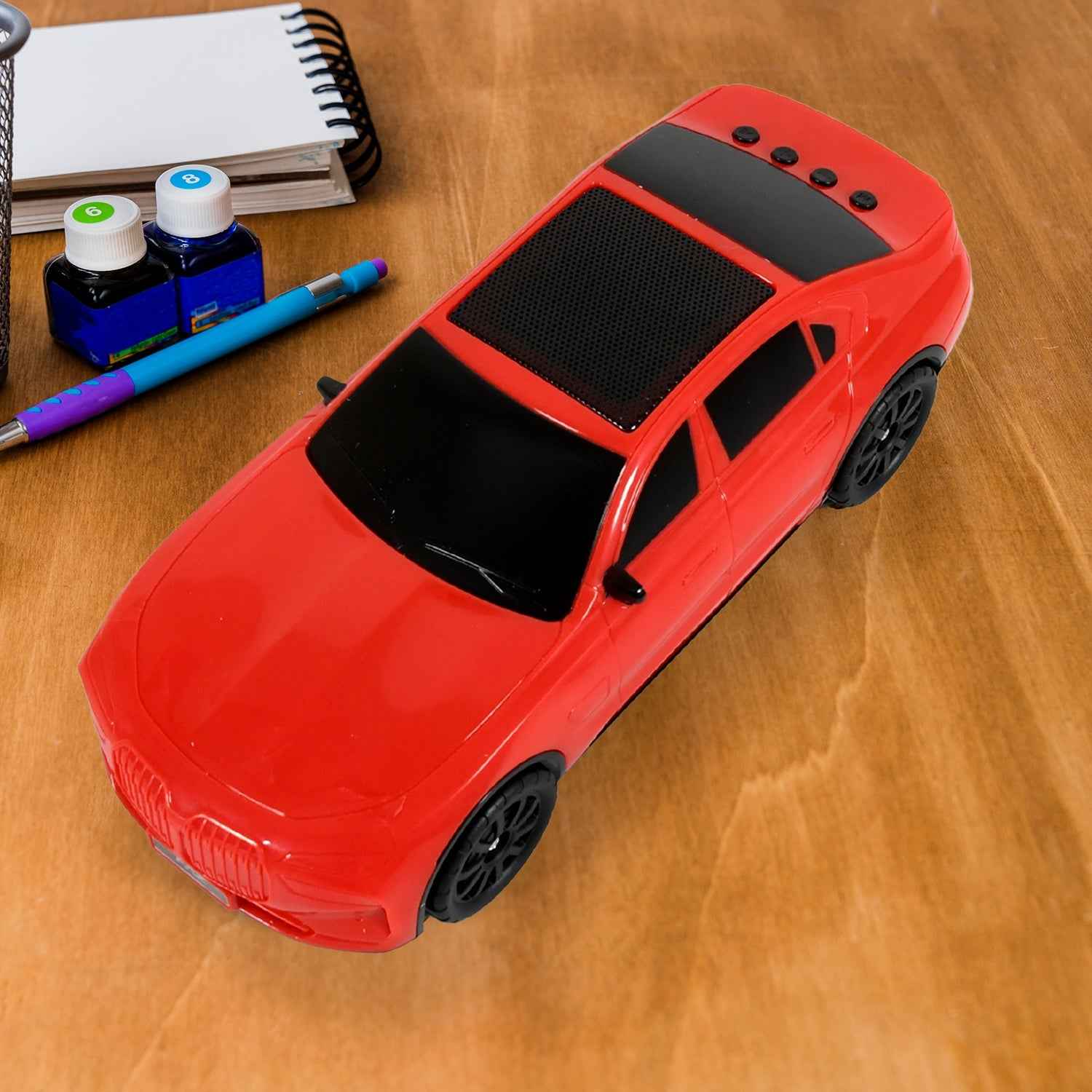 Audila Car Shape Wireless Speaker, showcasing its unique design and LED lights.